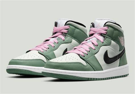 laced green jordans.